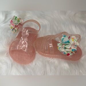 Baby’s Glittery Pink Sandals with Floral Accent